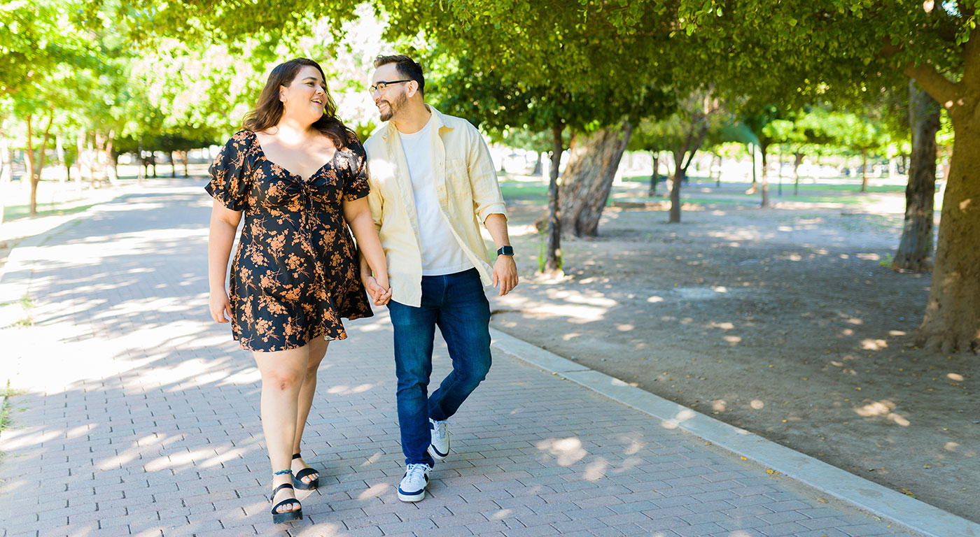 Image of couple waling in park.